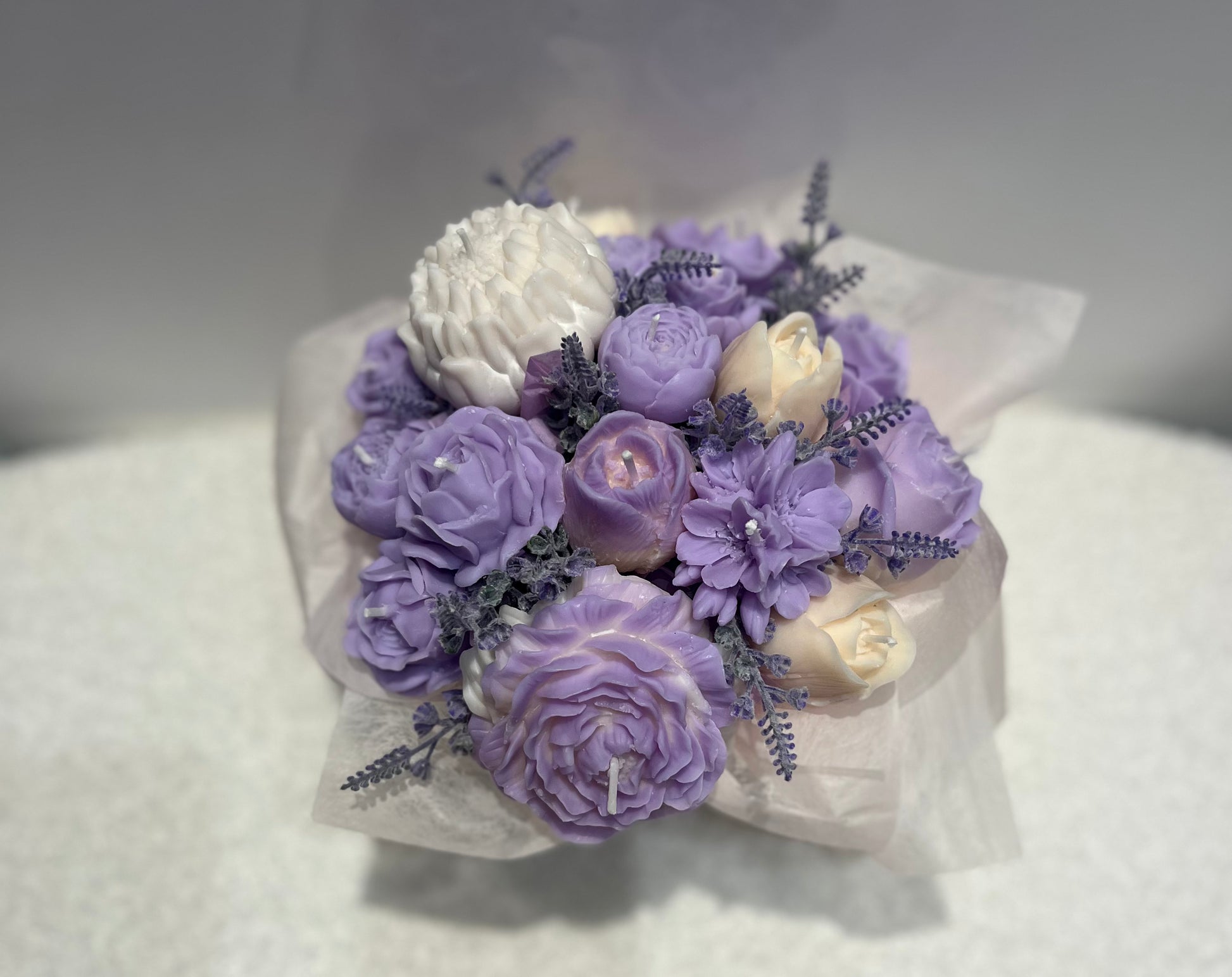 Bouquet of purple and white flowers on a white background