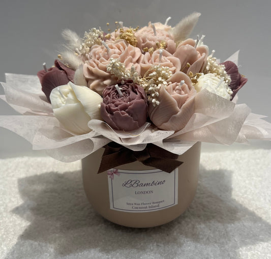 Bouquet of flowers in a container with 'L'Bambino London' label on a textured surface